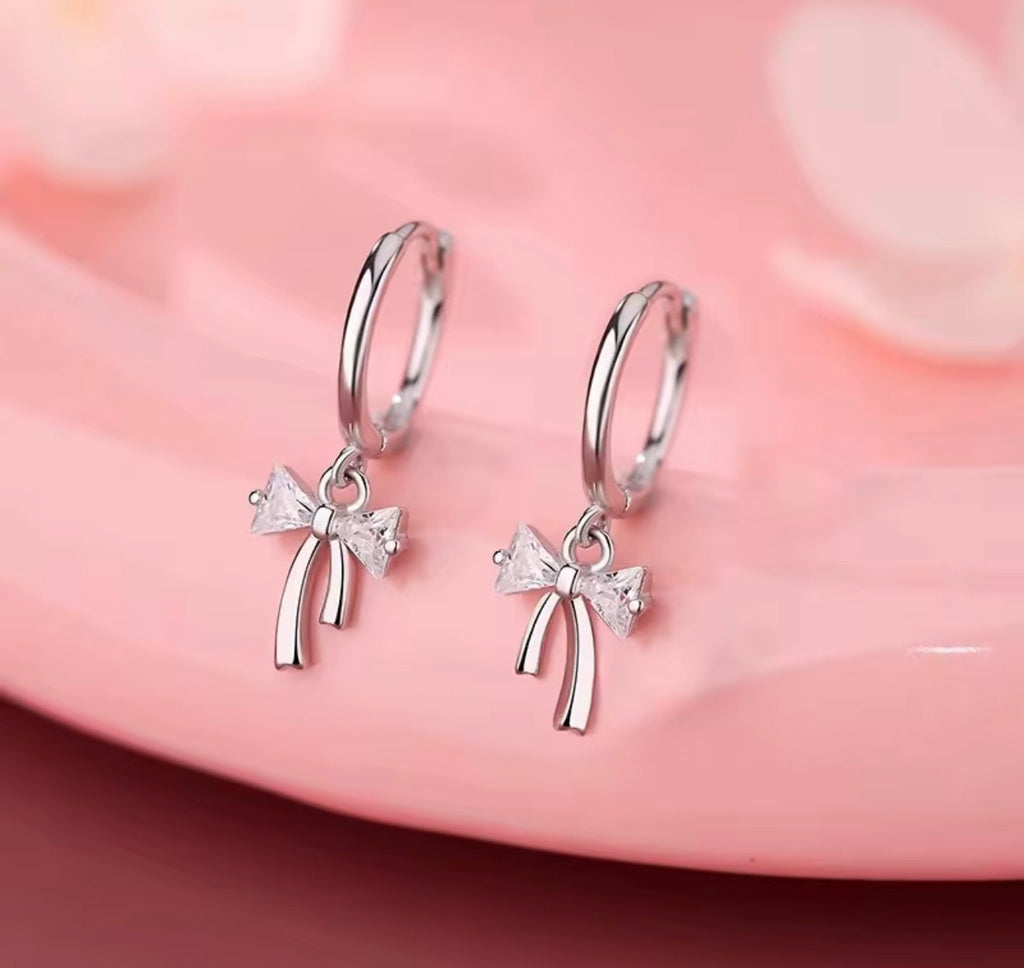 925 Sterling Silver Sparkling Bow Huggie Earrings