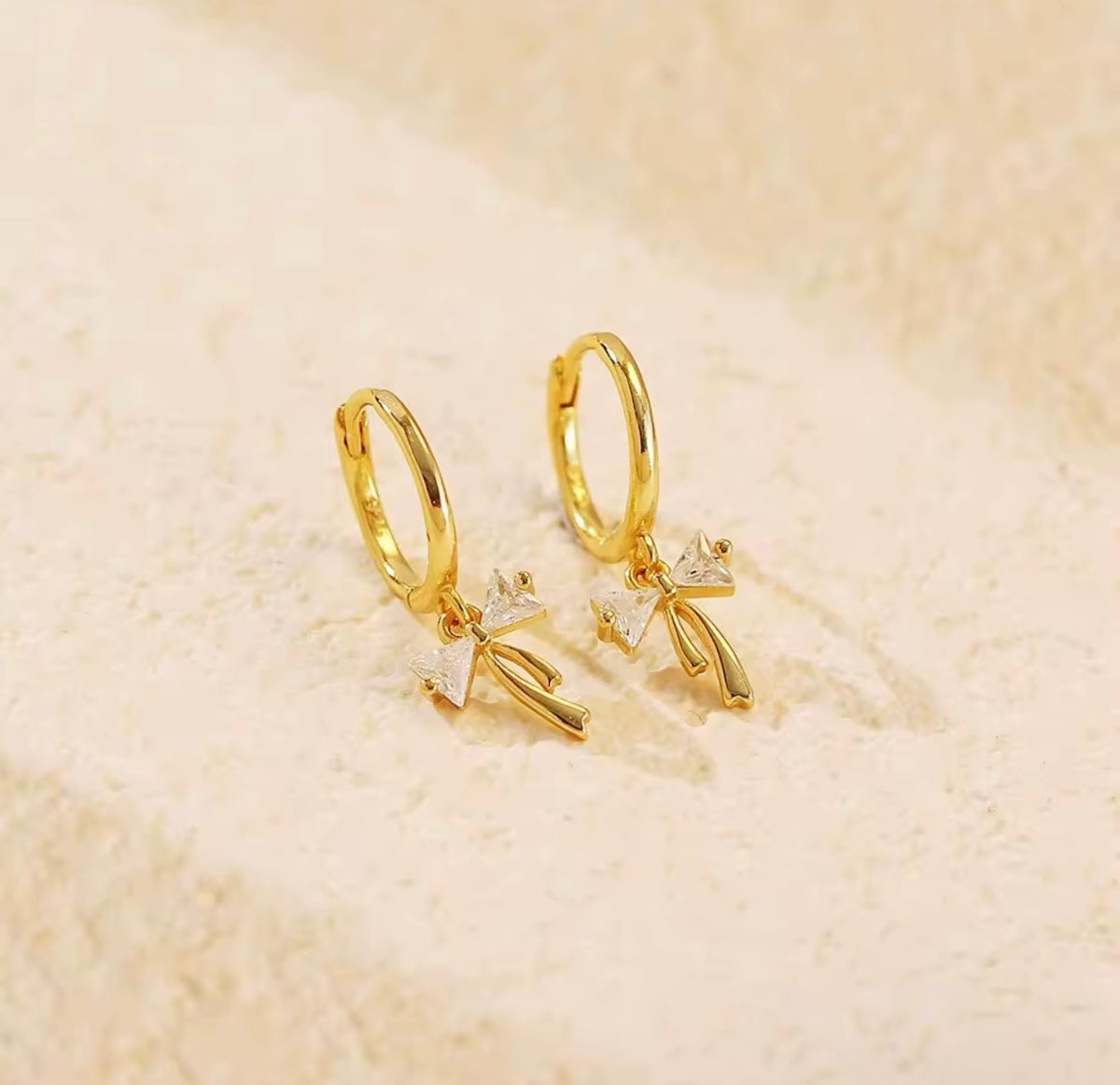 925 Sterling Silver Sparkling Bow Huggie Earrings