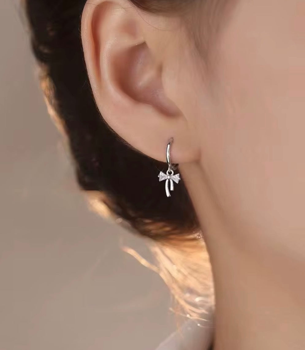 925 Sterling Silver Sparkling Bow Huggie Earrings